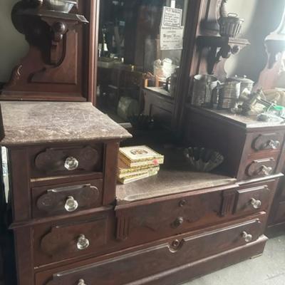 Step down marble top dresser