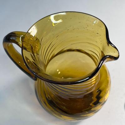 SMALL AMBER BLOWN GLASS PITCHER WITH SWIRLS 