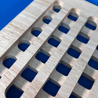 INTERESTING GRID PATTERN CARVED LIGHT WOOD TRIVET