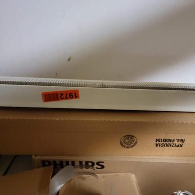 Electric heater & 2 cases of florescent light bulbs