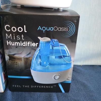 LOT 262. TWO HUMIDIFIERS ONE COOL MIST ONE WARM MIST