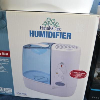 LOT 262. TWO HUMIDIFIERS ONE COOL MIST ONE WARM MIST