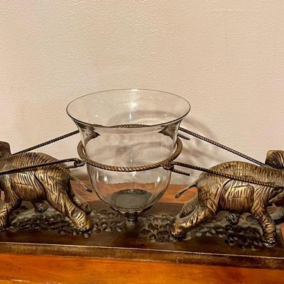 2 brass elephants with hurricane glass