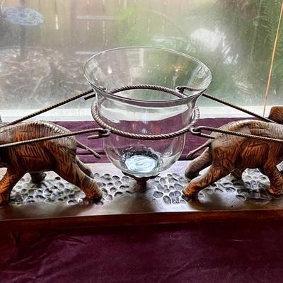 2 brass elephants with hurricane glass