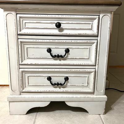 Realyn Three Drawer Nightstand