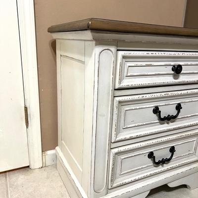 Realyn Three Drawer Nightstand