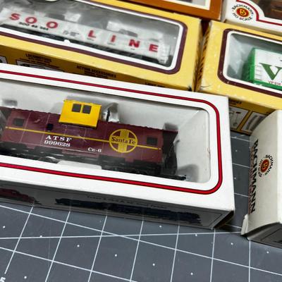 Several Train Cars Mostly new in the Box 