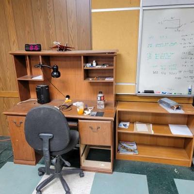 Desk, chair, credenza, boards on wall
