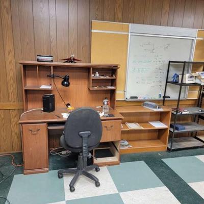 Desk, chair, credenza, boards on wall