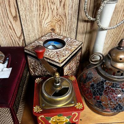 Lot of Bells, Grinder, Candle Holder and Brown Rug. 