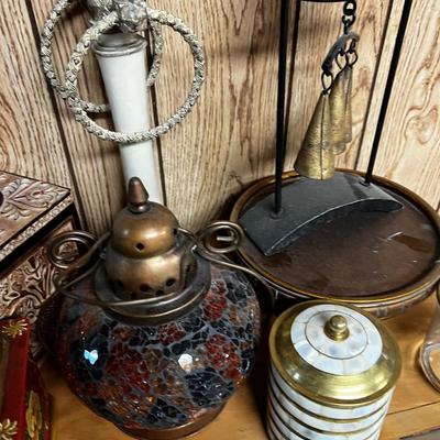 Lot of Bells, Grinder, Candle Holder and Brown Rug. 