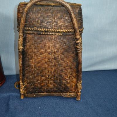 LOT 321. TALL BASKET AND HEAD REST/HOME DECOR