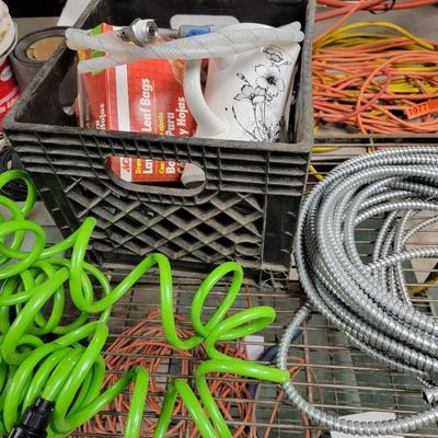 Metal rack, ext. cord, electrical wire, hose, gas hose