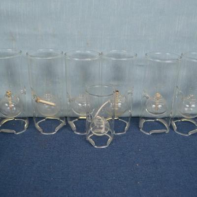 LOT 348  SEVEN GLASS OIL LAMPS
