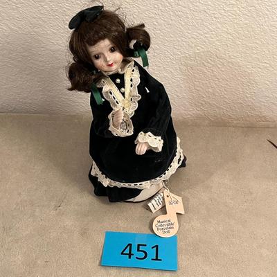 Doll in green dress musical
