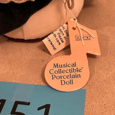 Doll in green dress musical