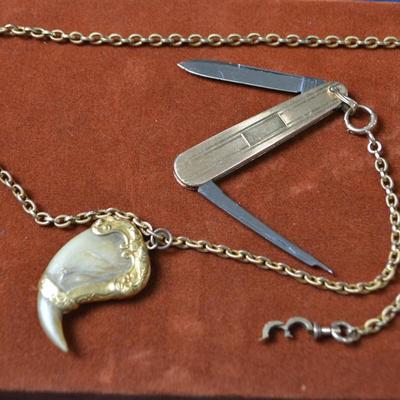 LOT 387. POCKET WATCH CHAIN WITH TIGER CLAW AND PEN KNIFE