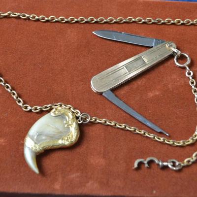 LOT 387. POCKET WATCH CHAIN WITH TIGER CLAW AND PEN KNIFE