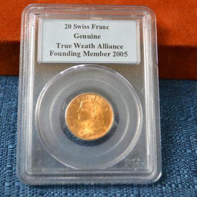 LOT 409. SWISS GOLD 20 FRANCS HELVETIA COIN