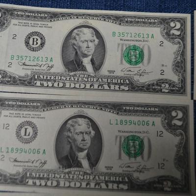 LOT 471. EIGHT TWO DOLLAR GREEN SEAL BILLS AND ONE DOLLAR SILVER CERTIFICATE