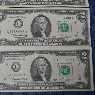 LOT 471. EIGHT TWO DOLLAR GREEN SEAL BILLS AND ONE DOLLAR SILVER CERTIFICATE