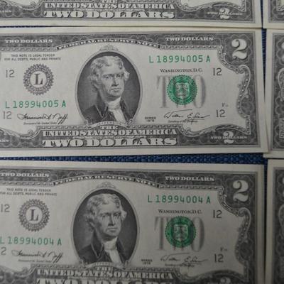 LOT 471. EIGHT TWO DOLLAR GREEN SEAL BILLS AND ONE DOLLAR SILVER CERTIFICATE