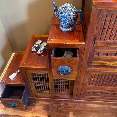 19th century Japanese design , made in Thailand, Tansu chest has drawers a wine rack & doors.