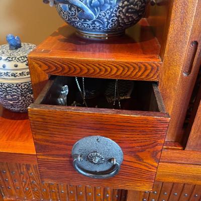 19th century Japanese design , made in Thailand, Tansu chest has drawers a wine rack & doors.