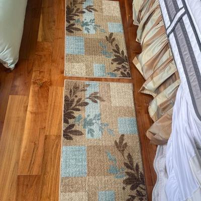 2 matching rugs. Each is 34â€ x 20â€