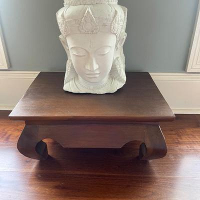 Quan Yin carved from stone statue. The Goddess of Wisdom. Solid wooden stand is included. Statue is 15â€ tall. Table is 18â€ x 13.5â€.