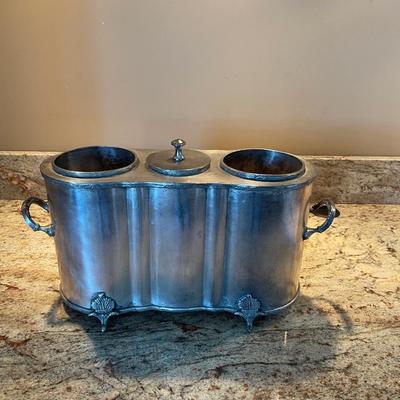 Antique pewter wine cooler and bottle holder.  Holds Wine bottles on each side and ice in the middle compartment. Very unique.