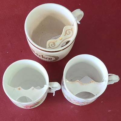3 Moustache cups  -  one has a chip