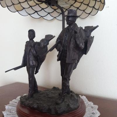 BRONZE LAMP W/GLASS SHADE OF A FATHER AND SON RETURNING HOME FROM HUNTING