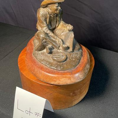 Geo Phippen bronze sculpture of sitting cowboy
