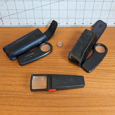 3 black magnifiers
