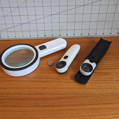 3 white magnifiers