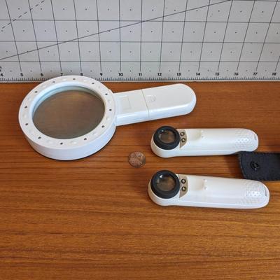 3 white magnifiers