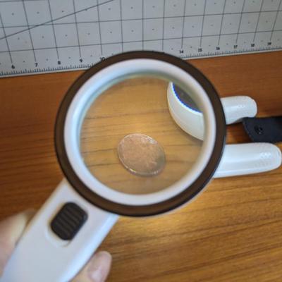 3 white magnifiers