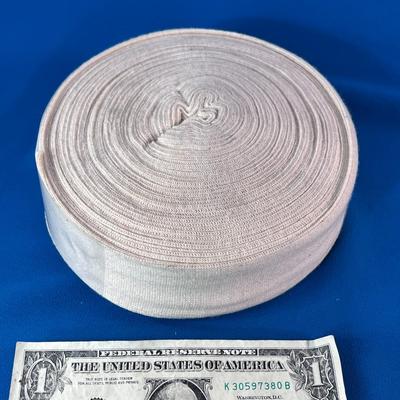 LARGE ROLL OF STRETCHY ACE-BANDAGE-LIKE MATERIAL