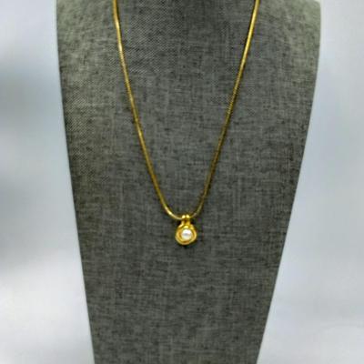 Gold toned faux pearl necklace