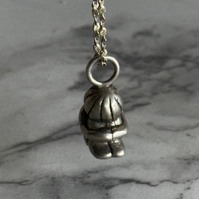 Small sterling silver pendant of child with sterling chain