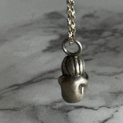 Small sterling silver pendant of child with sterling chain