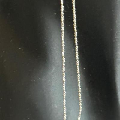 Small sterling silver pendant of child with sterling chain