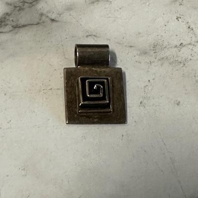 MCM sterling silver pendant