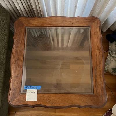 Wooden end table with glass top