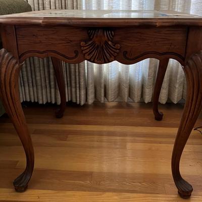 Wooden end table with glass top
