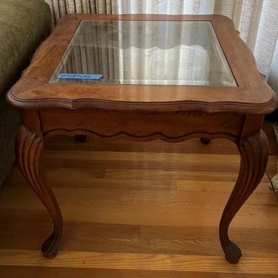 Wooden end table with glass top