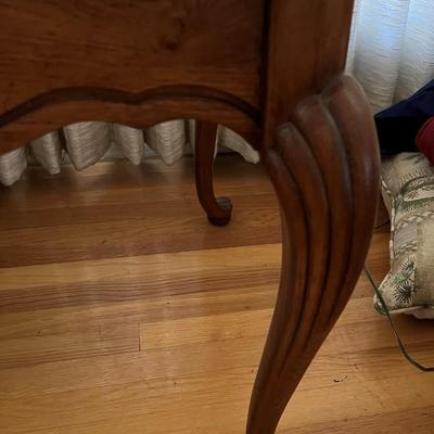 Wooden end table with glass top