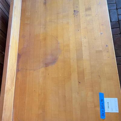 White metal cabinet with wooden countertop