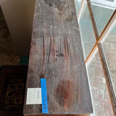 Dark wood cabinet with glass doors